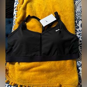 Nike sports bra SZ XL/1X in black with white check mark. NWT. Asking $25